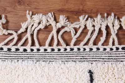 White beni ourain rug in living room