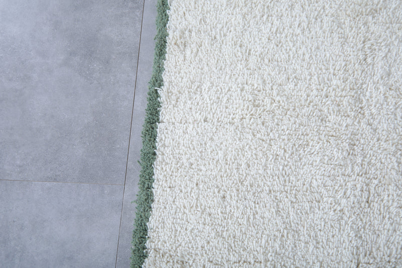 Handwoven Wool Rug in White with Green Frame Border