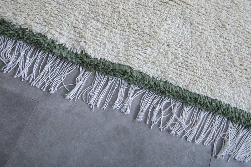 Handwoven Wool Rug in White with Green Frame Border