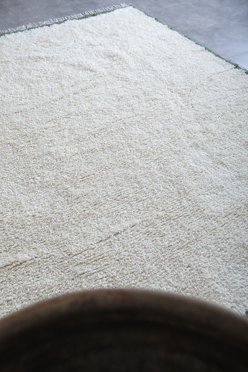 Handwoven Wool Rug in White with Green Frame Border