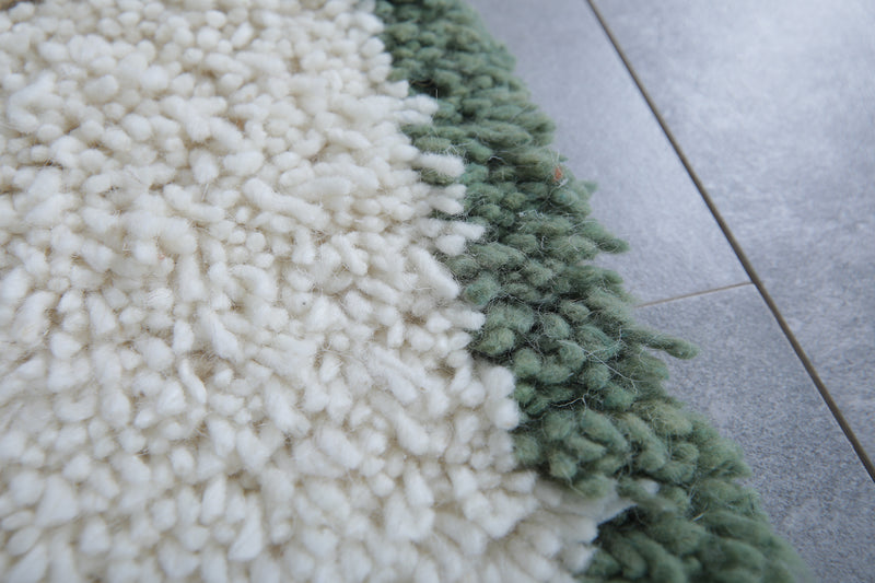 Handwoven Wool Rug in White with Green Frame Border