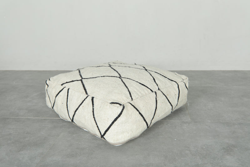 Minimalist white and black Moroccan kilim pouf