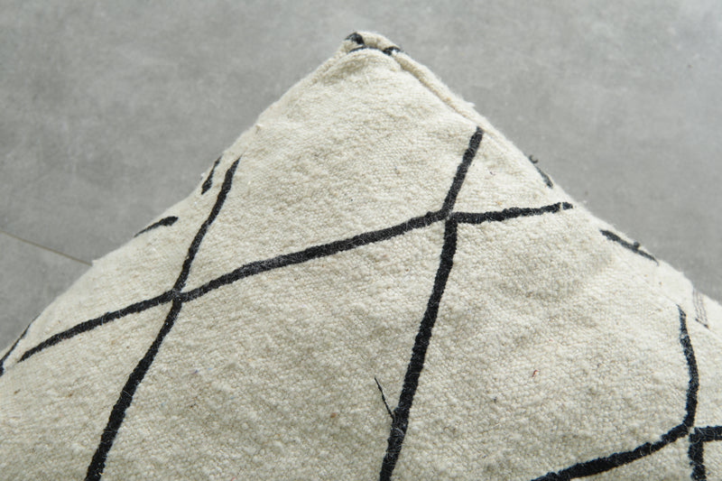 Minimalist white and black Moroccan kilim pouf