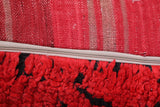 Red Berber ottoman pouf with black stripes