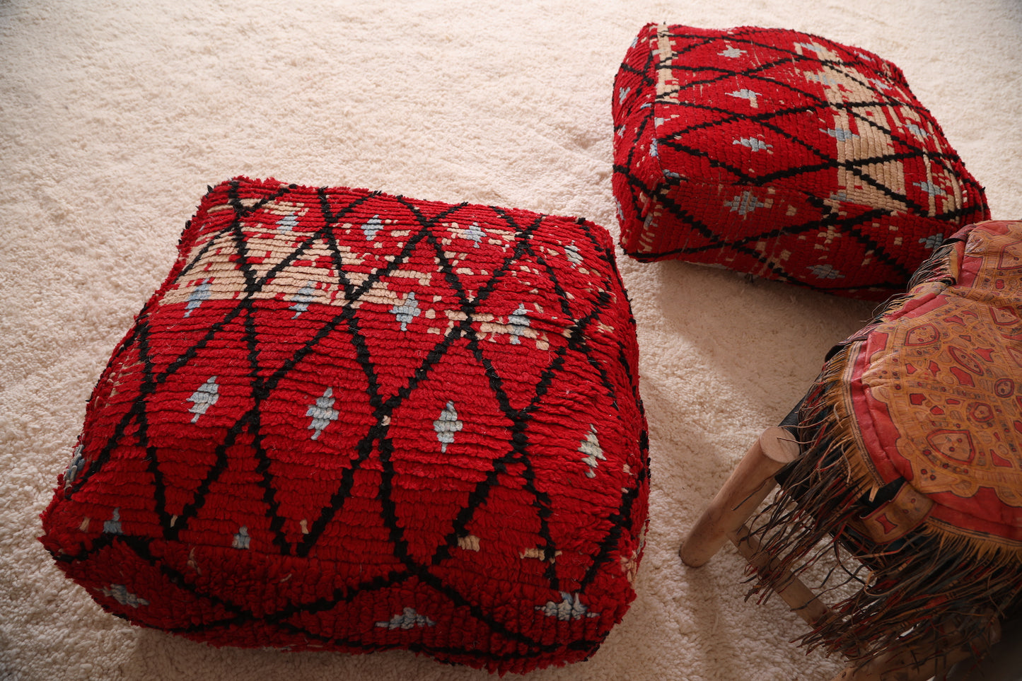 Two Ottoman Moroccan Trellis poufs in Red