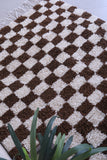 Brown and white checkered rug 5.2 X 5.8 Feet