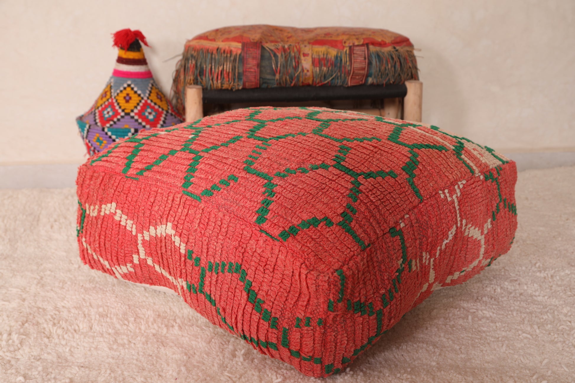 Moroccan red pouf ottoman with green trellis
