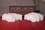 Two White Shaggy ottoman Cushions